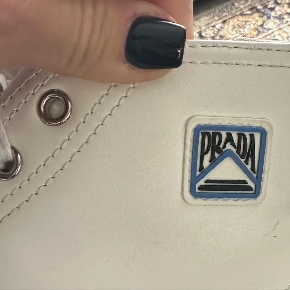 PRADA all white leather high top sneakers size 34 with original box on real real